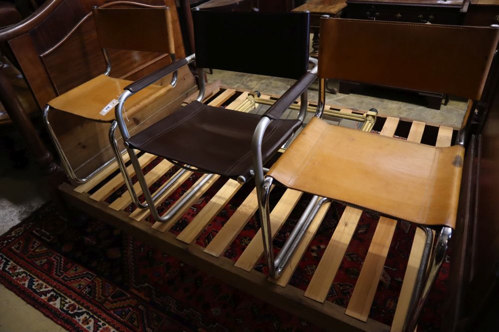 Three mid century design tubular metal and leather cantilever chairs